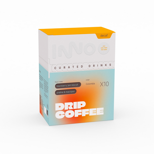 Box of drip specialty decaf coffee with colorful design on a white background