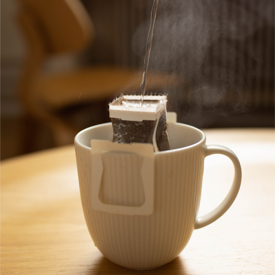 Drip bag specialty coffee brewing in the white cup
